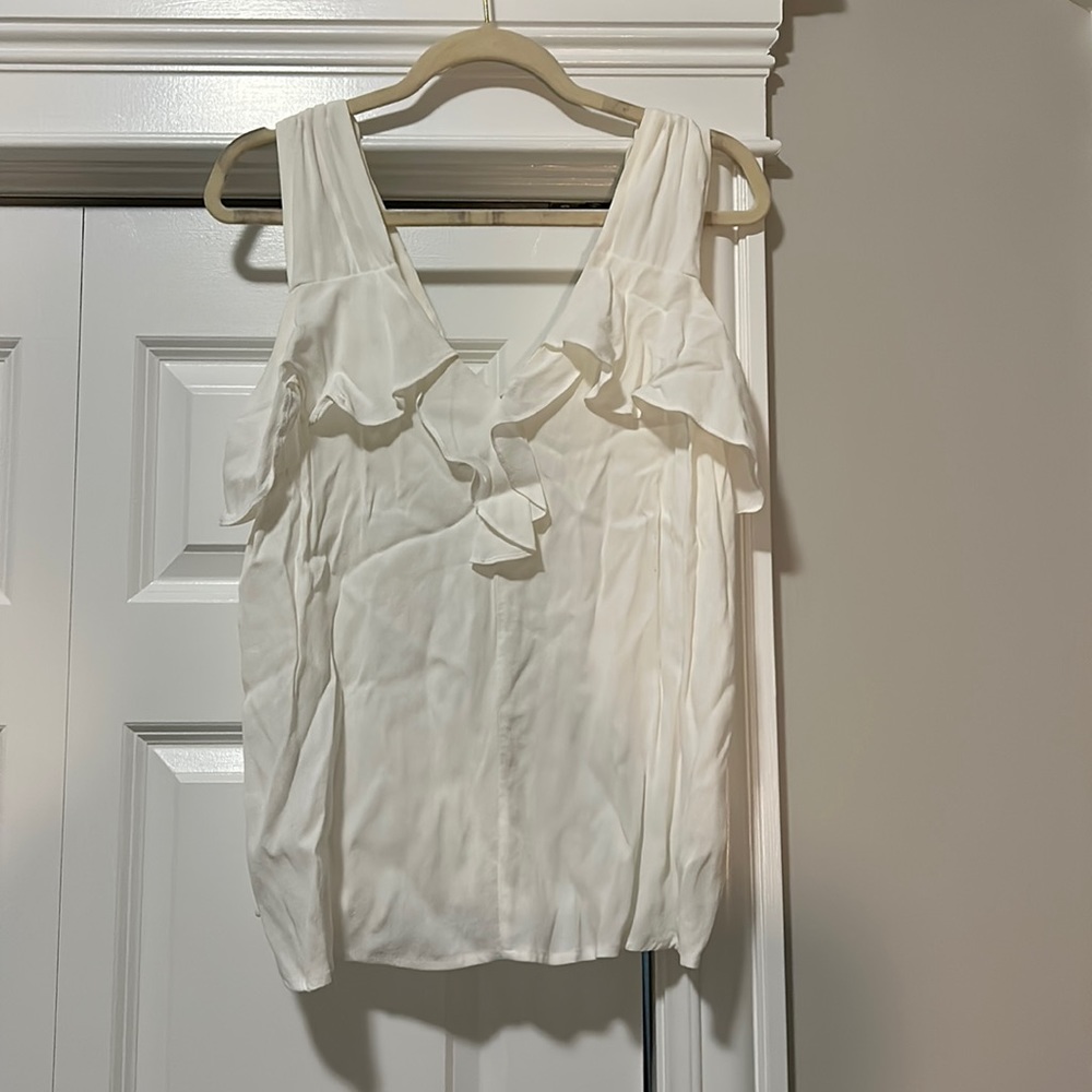 Never worn! White ruffle sleeveless top